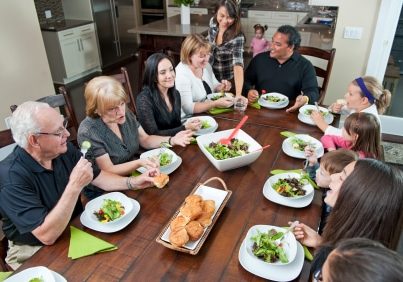 a family dinner / the family interaction / that is happening