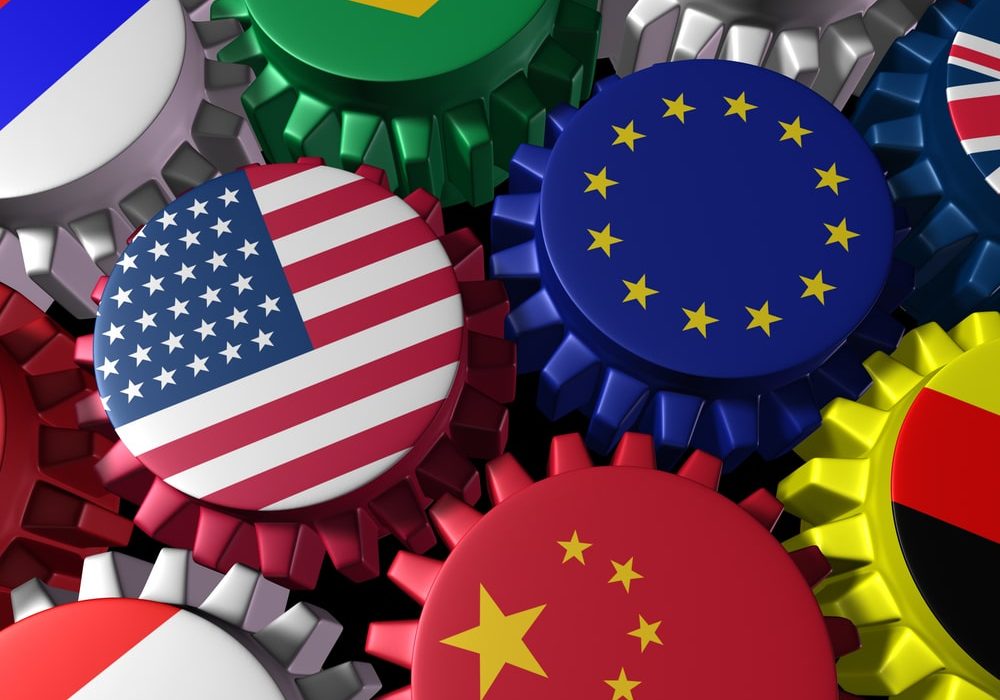 Global world economy machine with U.S.A and Europe  in the center represented by gears and cogs with the countries flags of Greece Russia China Canada Germany Brazil and Britain representing international trade and world imports and exporting industry.