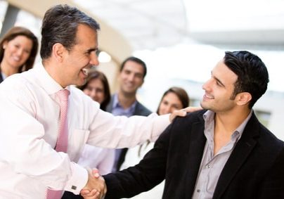 Business men closing deal with a handshake